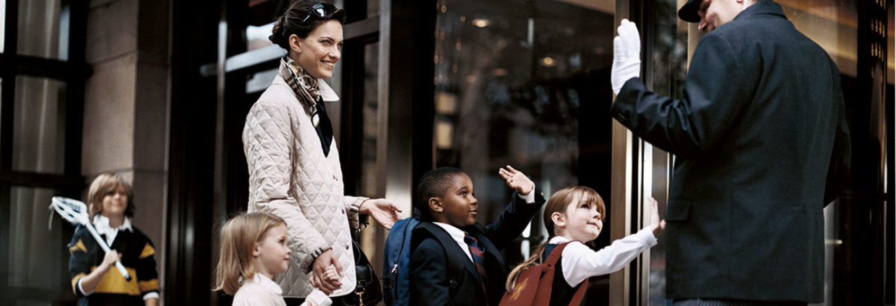 doorman, doorman greeting children, luxury doorman