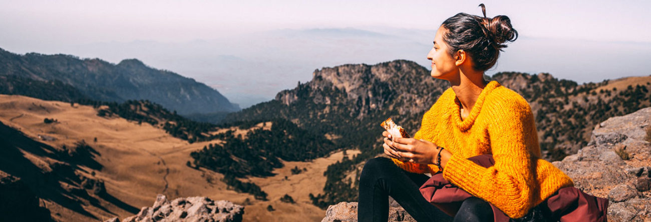 woman on a hike, woman hiking, woman atop mountain